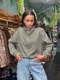 Veste à carreaux col montant avec bouton pression